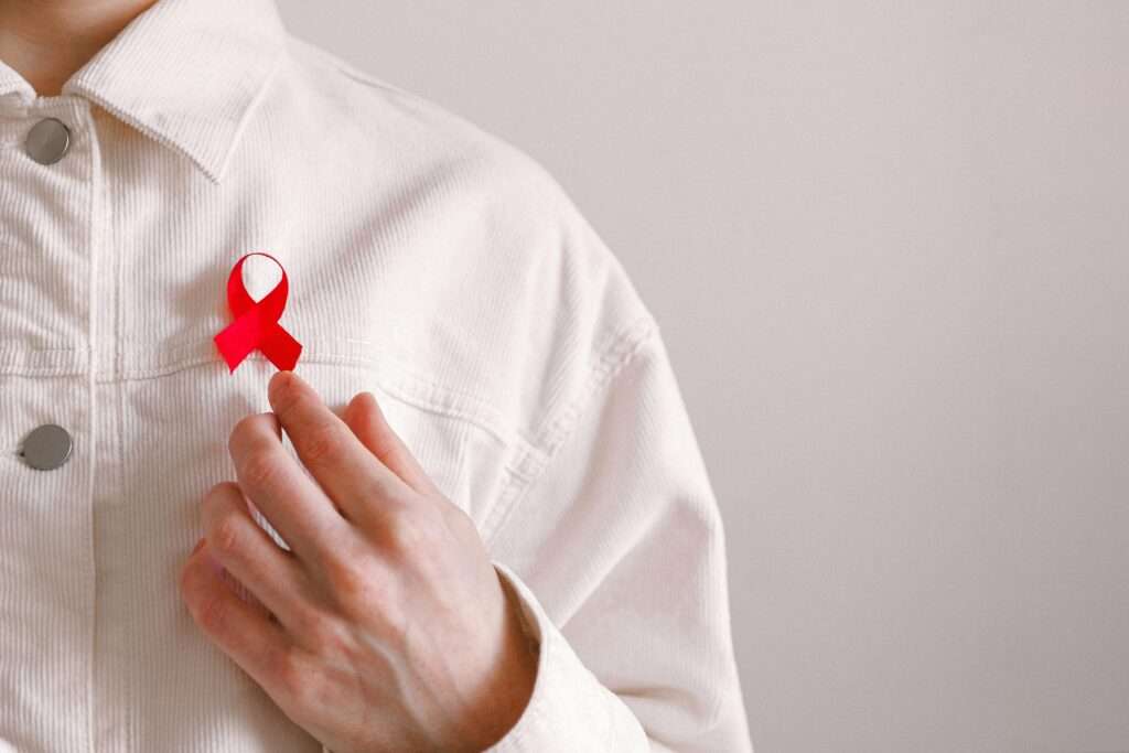 Man Wearing Red Ribbon